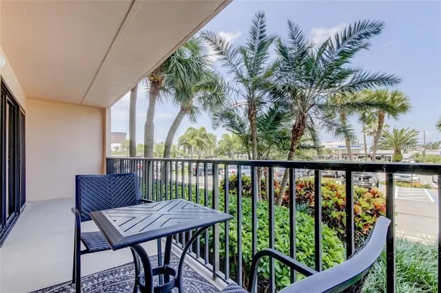a view of a balcony with furniture