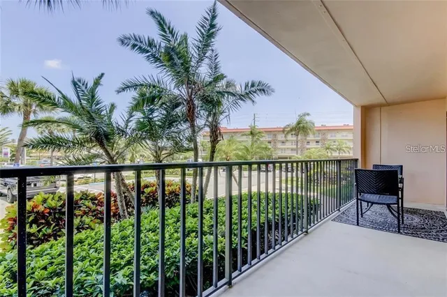 a view of a balcony with furniture