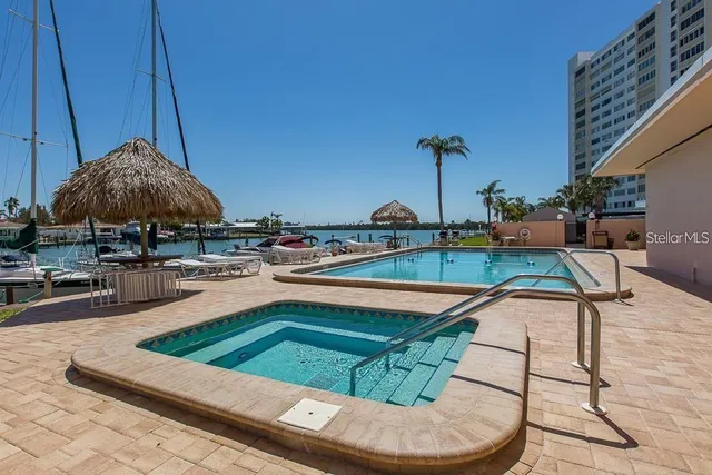 a view of a swimming pool with a lounge chairs
