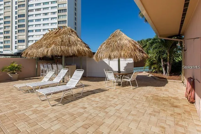 a view of a swimming pool with a lounge chair