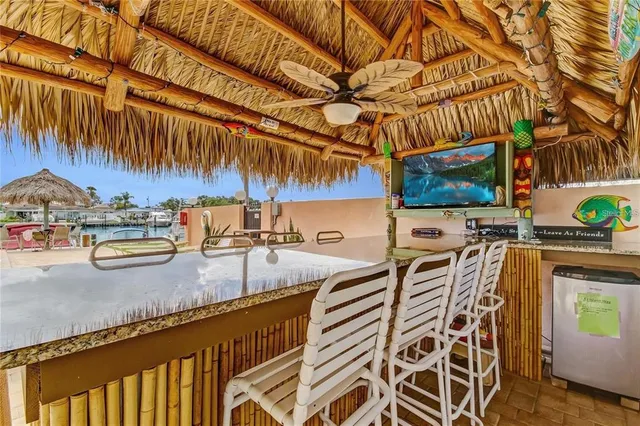 a view of outdoor kitchen with outdoor seating