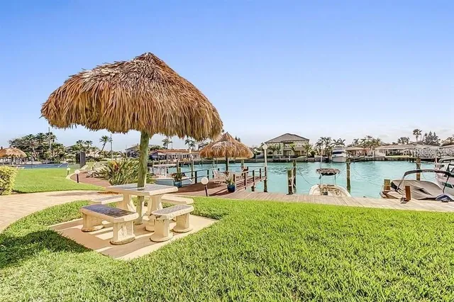 a swimming pool with outdoor seating and yard