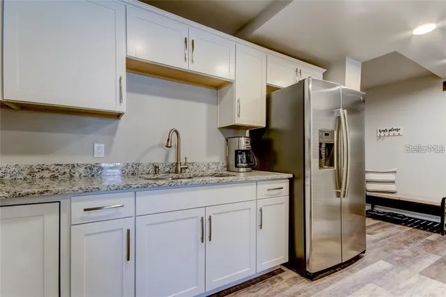a kitchen with appliances and cabinets