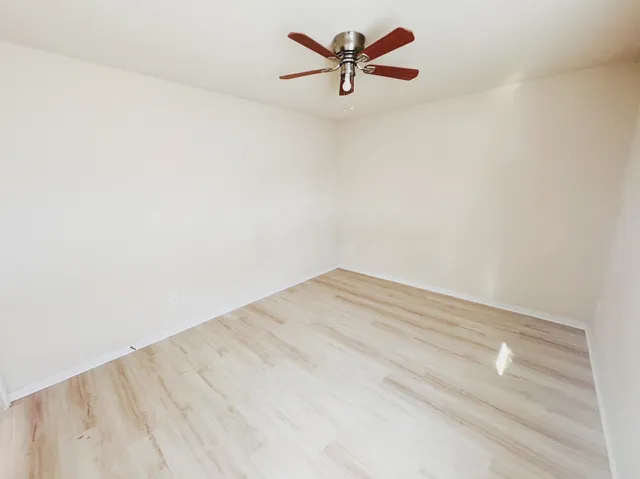 a view of a big room with wooden floor