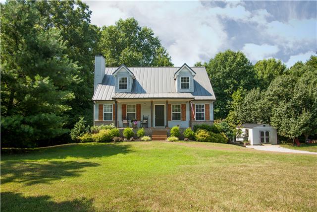 Charming home on five acres with great outdoor living spaces, covered front porch with cedar posts and shutters, covered back porch and covered patio!