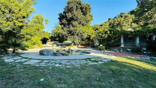 a view of a swimming pool with a patio
