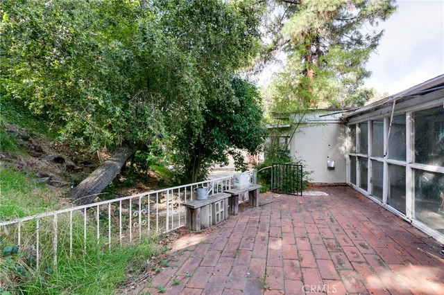 a view of a chair and table on the wooden floor