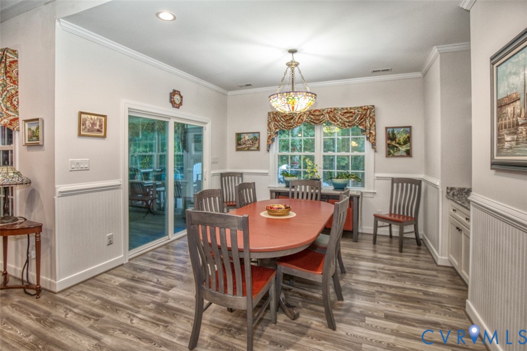 7075 Menzels Road Toano, VA 23168 - Photo 16 of 50 Wood-finish flooring with white wainscoting and cr
