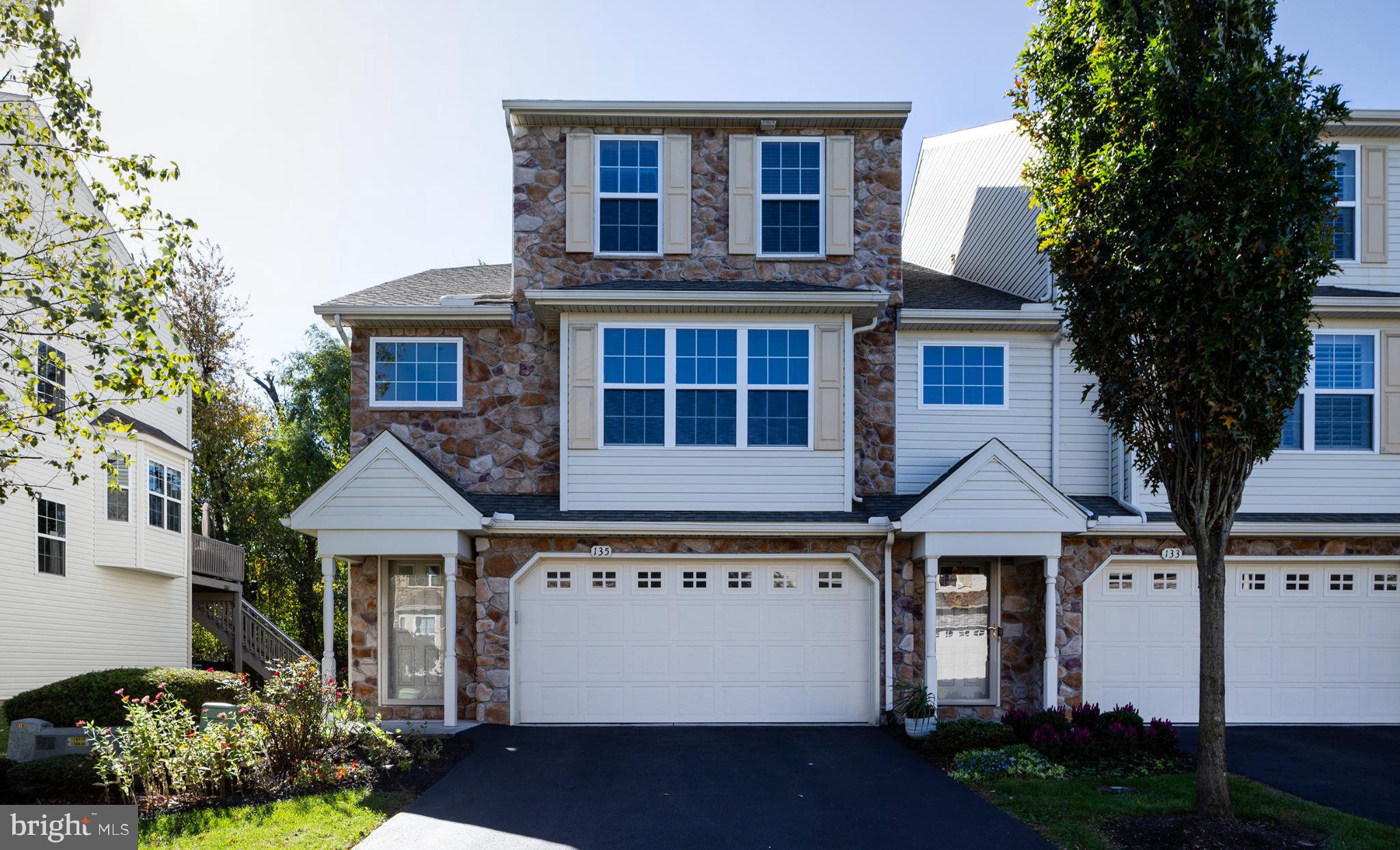 Charming stone-front townhouse with modern appeal.