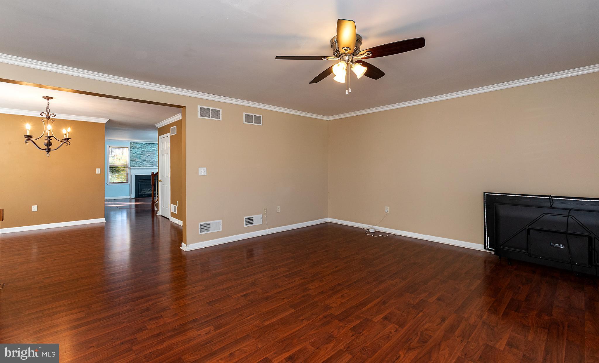 135 Mapleton Boulevard Harrisburg, PA 17112 - Photo 26 of 45 Spacious living area with warm tones.