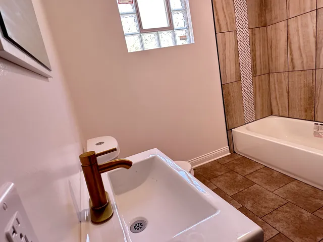 a bathroom with a sink and a tub
