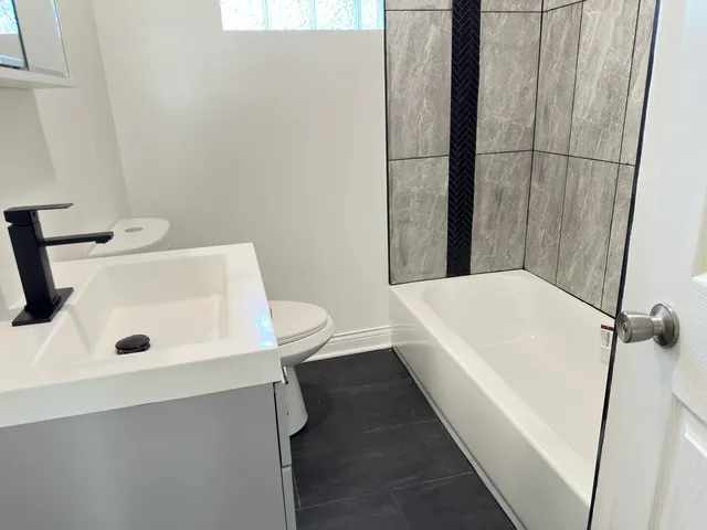 a bathroom with a sink and a tub