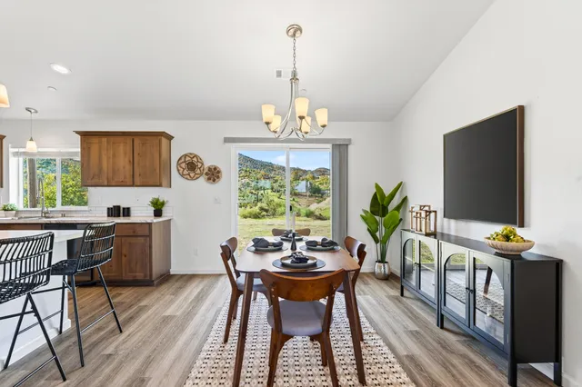 a view of a dining room with furniture window and outside view