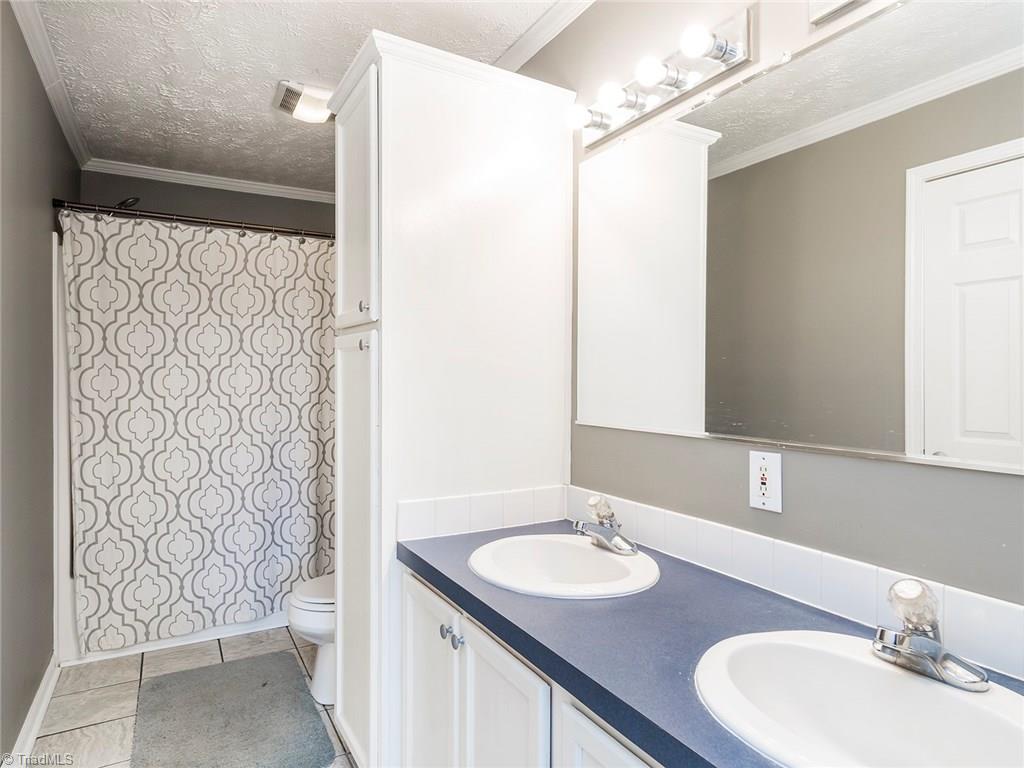 500 Vernon Road Reidsville, NC 27320 - Photo 11 of 24 Master bath offers great storage space and double vanities.
