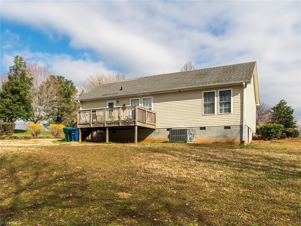 500 Vernon Road Reidsville, NC 27320 - Photo 2 of 24 Lg backyard!! Deck offers space for table and chairs. Storage building out back.