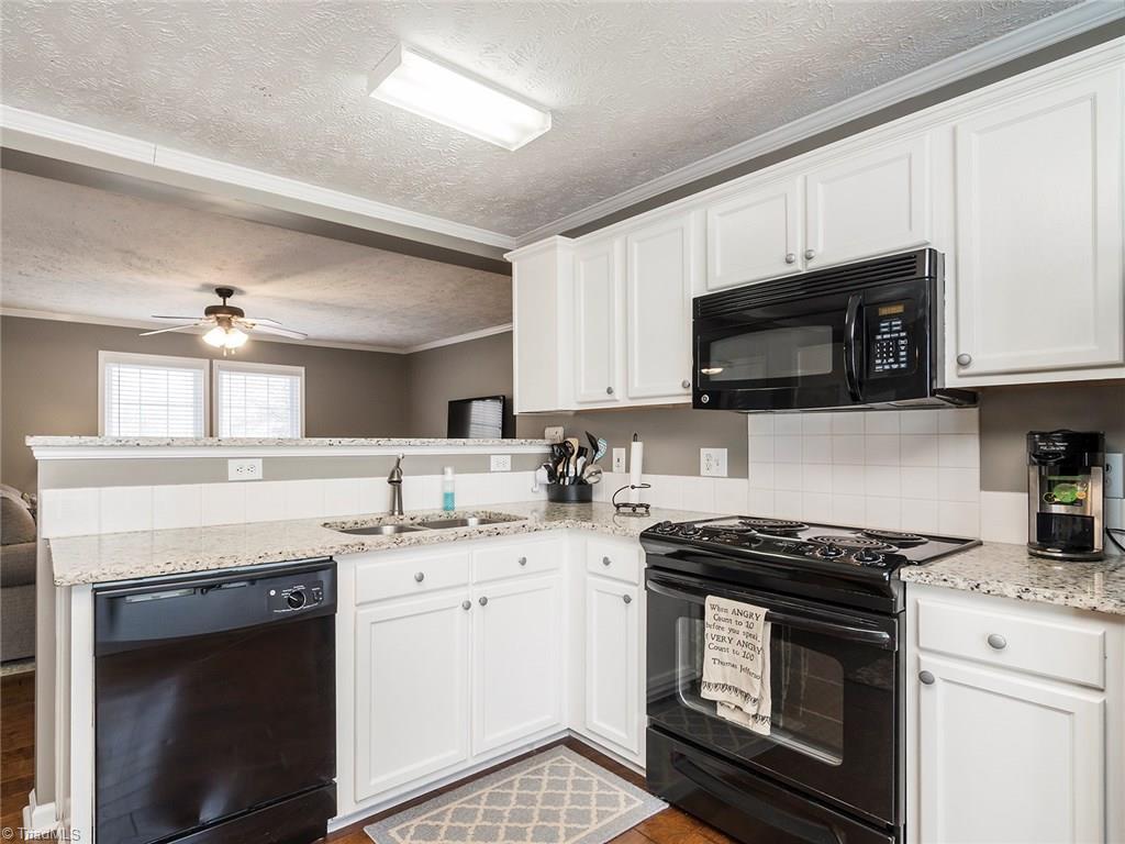 500 Vernon Road Reidsville, NC 27320 - Photo 7 of 24 The kitchen is overlooking the living room.