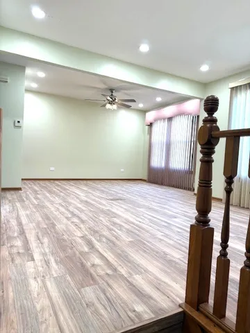 a view of empty room with windows