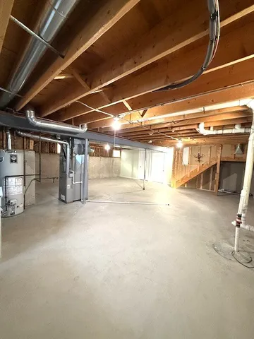a view of empty room with wooden ceiling