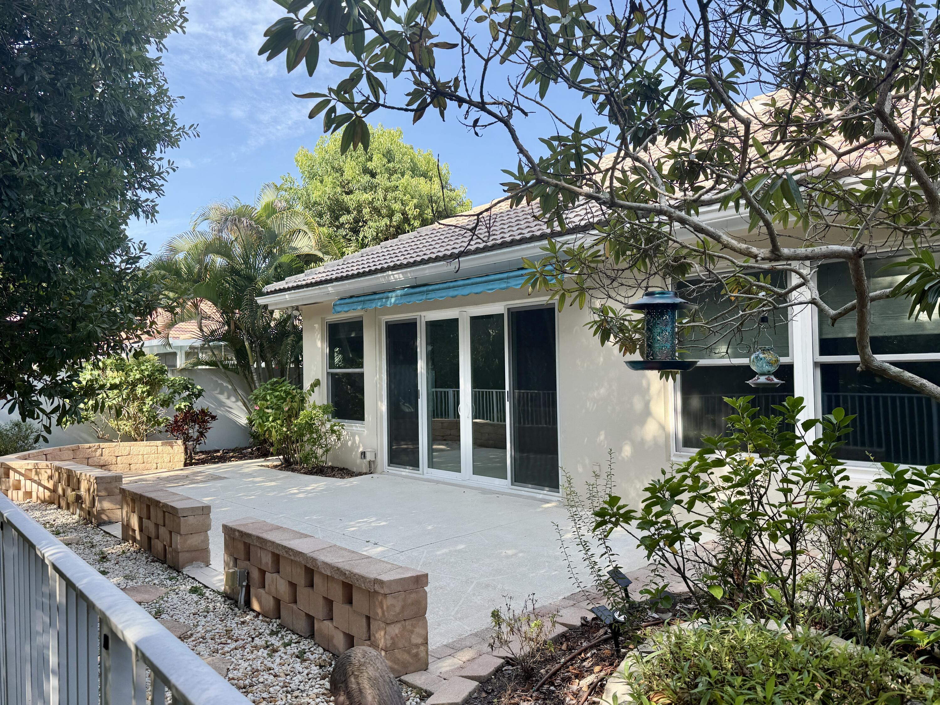 198 Hampton Circle Jupiter, FL 33458 - Photo 6 of 19 Patio with Retractable Awning