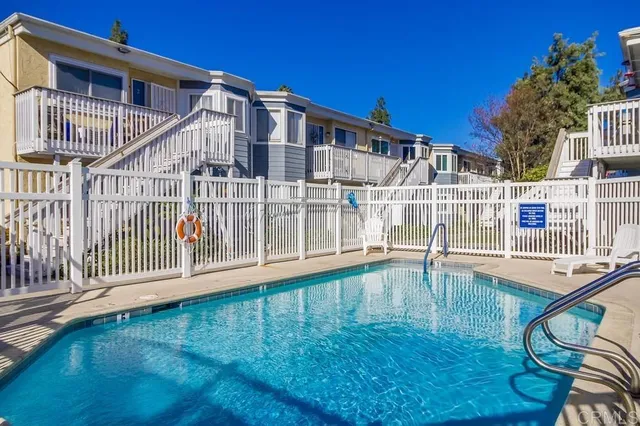 front view of a house with a swimming pool