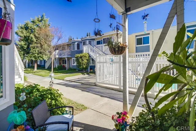 a view of a house with a flower garden