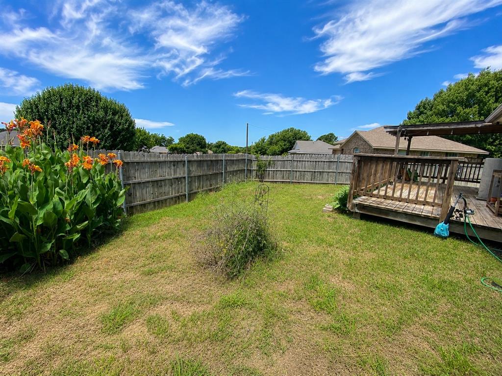 404 Old Mansfield Road Keene, TX 76059 - Photo 28 of 33 View of yard from corner of house in backyard