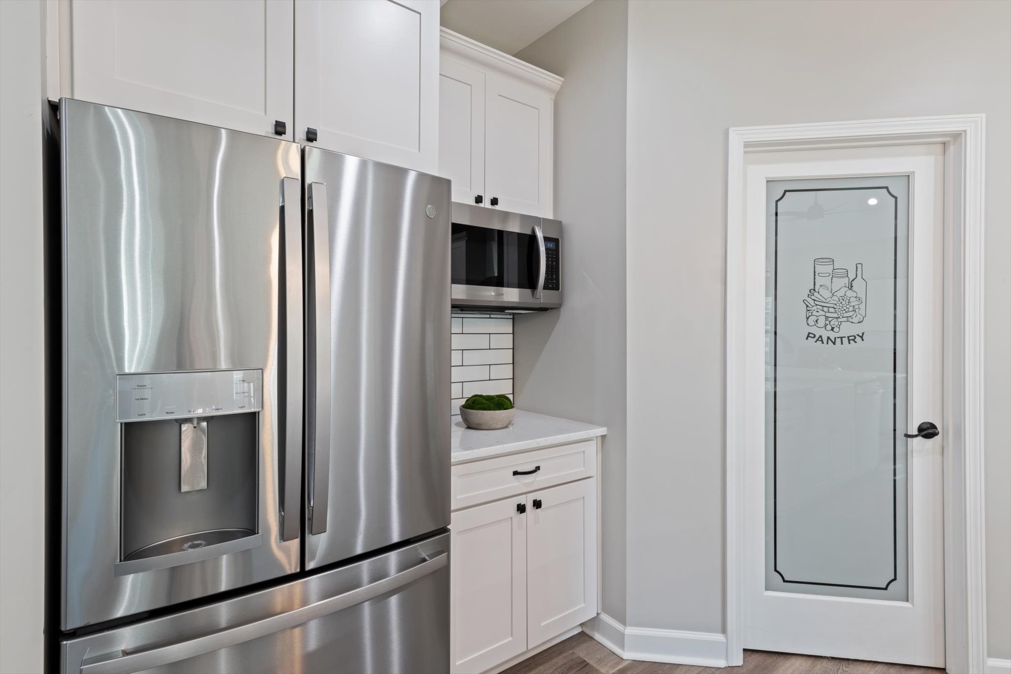 1397 Taylortown Road White Bluff, TN 37187 - Photo 14 of 26 a kitchen with stainless steel appliances a refrigerator and cabinets