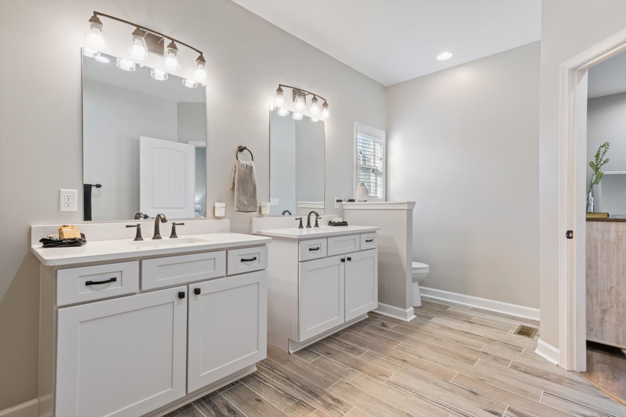 1397 Taylortown Road White Bluff, TN 37187 - Photo 19 of 26 a bathroom with a double vanity sink and a mirror