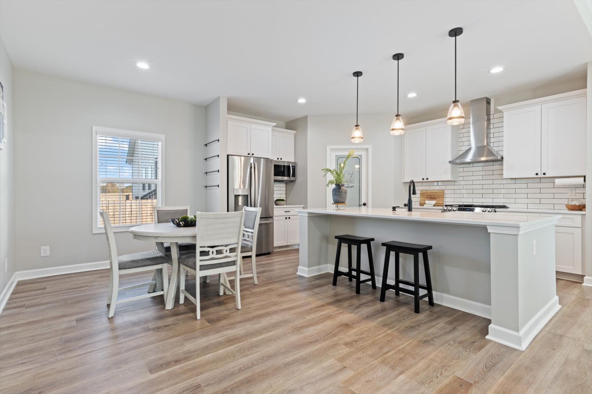 1397 Taylortown Road White Bluff, TN 37187 - Photo 9 of 26 a kitchen with kitchen island granite countertop a sink a center island stainless steel appliances and cabinets