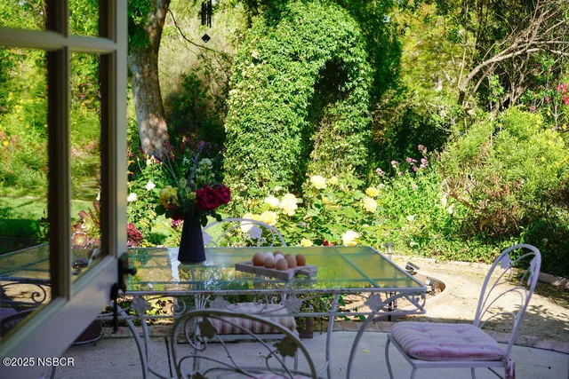 a view of yard with patio