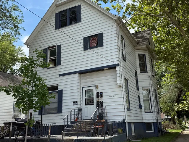 a front view of a house with a yard