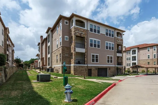 a front view of building with yard