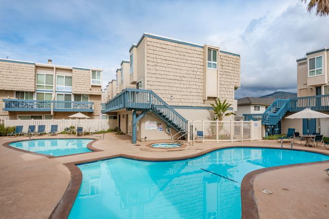 a view of a large building with a swimming pool