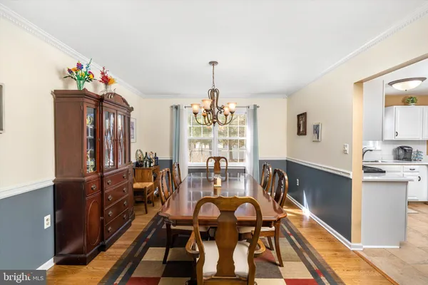 a view of a room with a mirror and a glass door