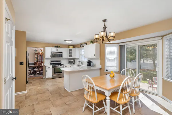 a lamp on a table near a window