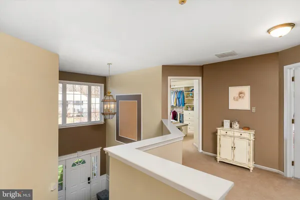 a bedroom with furniture and a flat screen tv