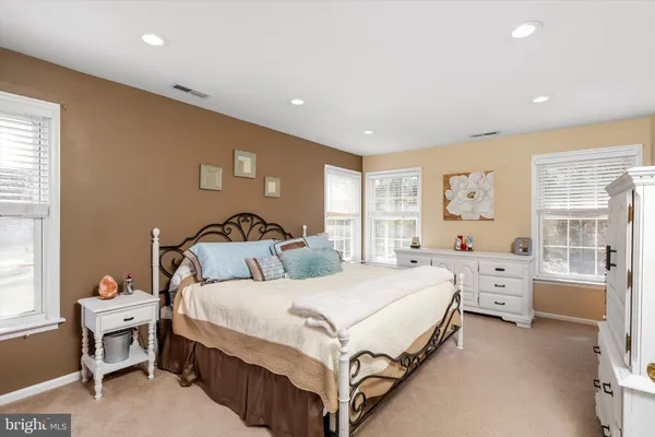 a bathroom with a granite countertop double vanity sinks and a mirror