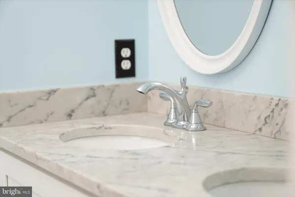 a bathroom with a bathtub and a sink