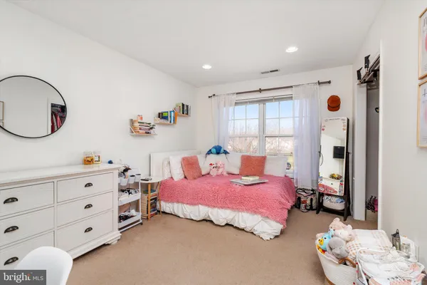 a room with a bed and a flat screen tv