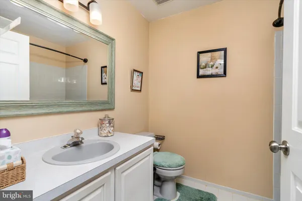 walk in closet with clothes and shoes