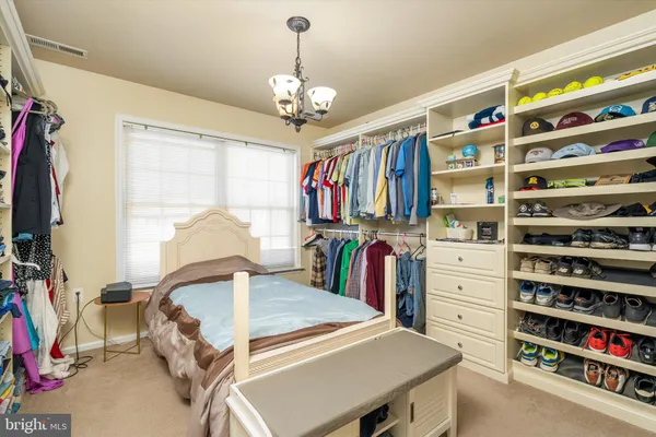 a bathroom with a granite countertop sink toilet mirror and shower