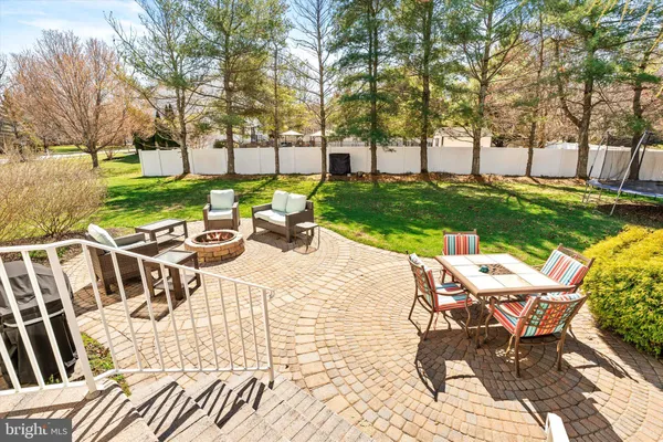a view of a park with large trees