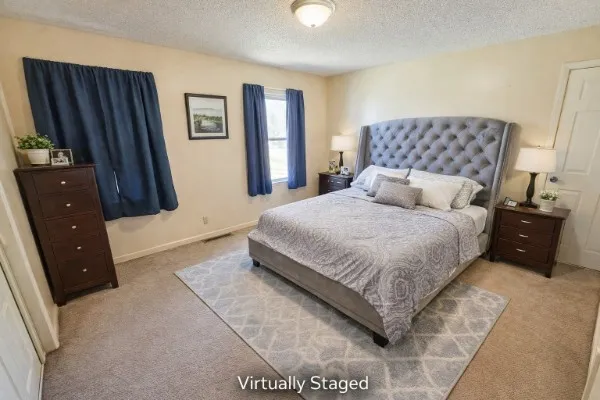a bedroom with a bed and a walk in closet
