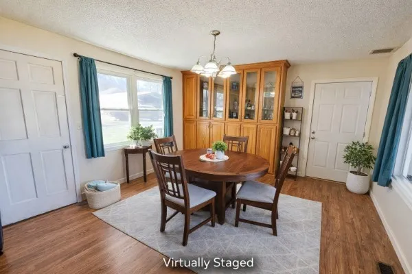 a view of a dining room with furniture window and wooden floor
