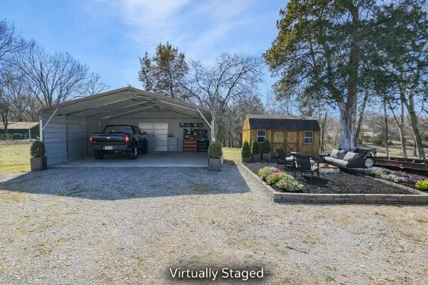 a view of a car park in front of house