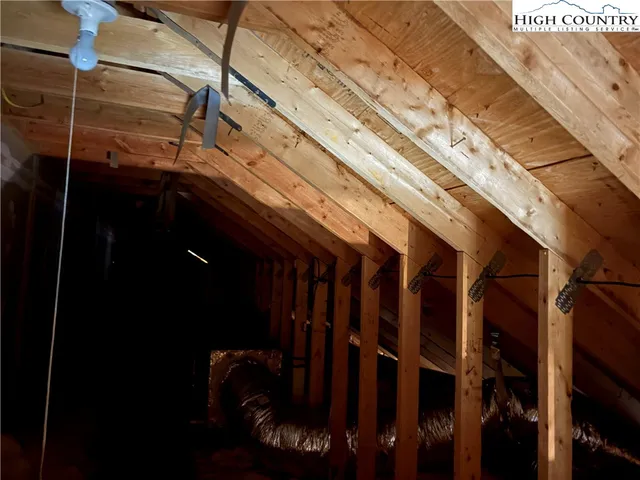a view of staircase with white walls