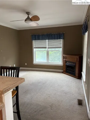 a view of livingroom with furniture and window