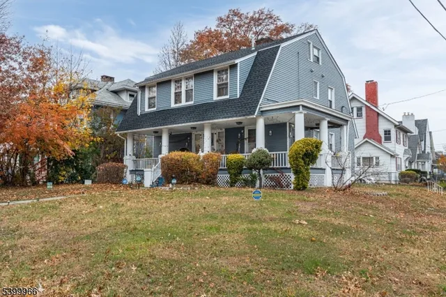 a view of a house with backyard porch and sitting area