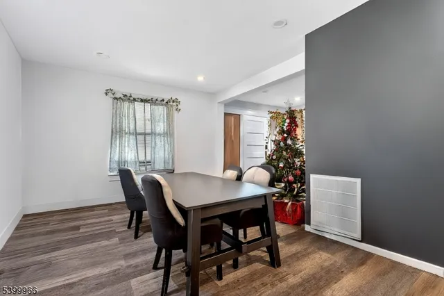a view of a dining room with furniture and window