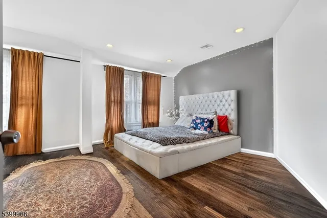 a bed room with a bed and a window